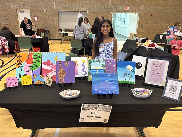 Decorated event spaces like Santa’s Workshop and The Great Elven Hall set up for attendees.